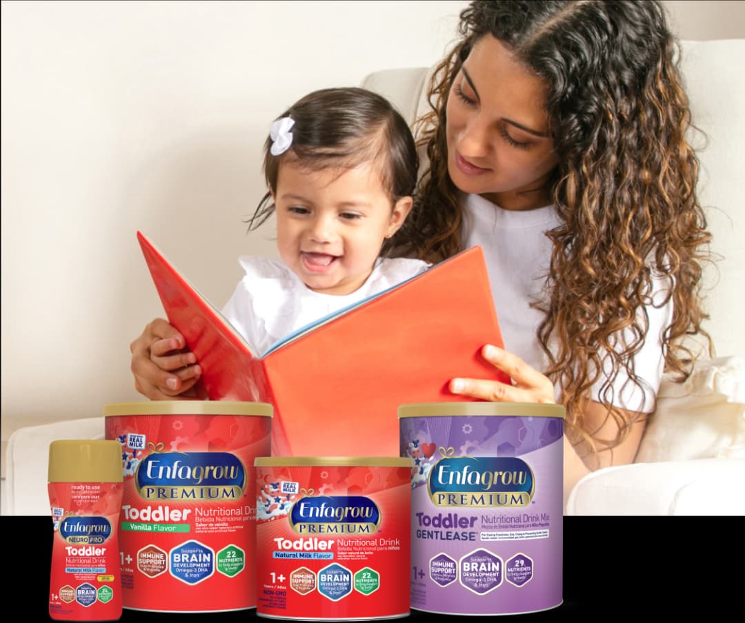 Mom reading book with child and lineup of Enfagrow Toddler products