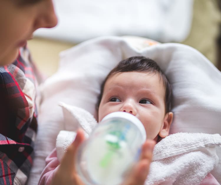 Mom Bottle Feeding Baby