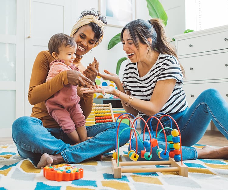 Parents playing with their child