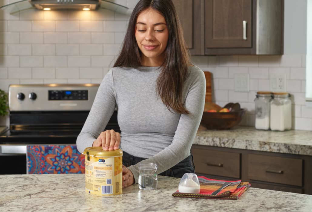 Mom preparing to make a bottle of formula