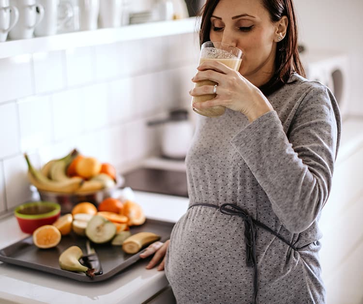Mother drinking from a glass
