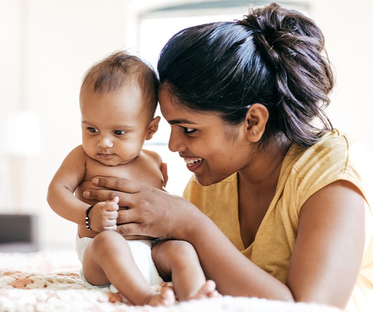 Mom holding 6 month old baby