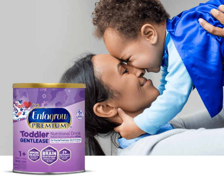 Mom holding baby in the air and rubbing noses