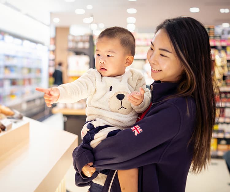 baby pointing something with his finger