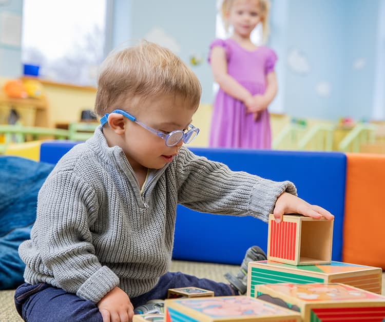 Toddler playing with cubes
