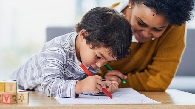 Mom coloring with toddler
