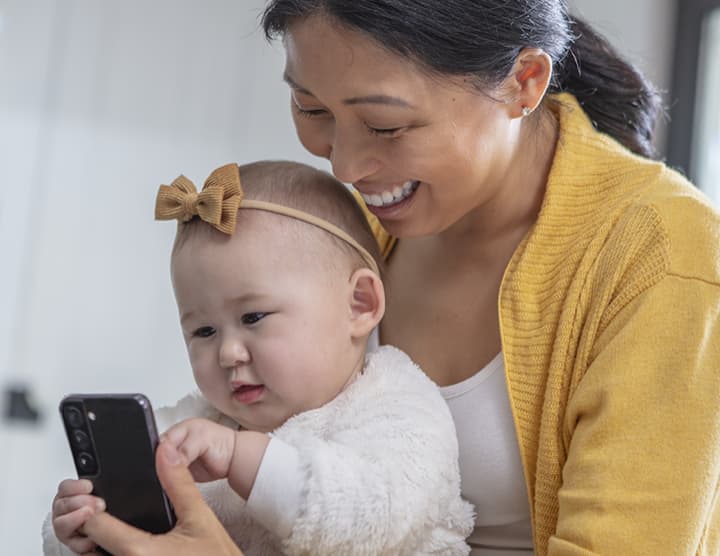 Mom laughing with her baby
